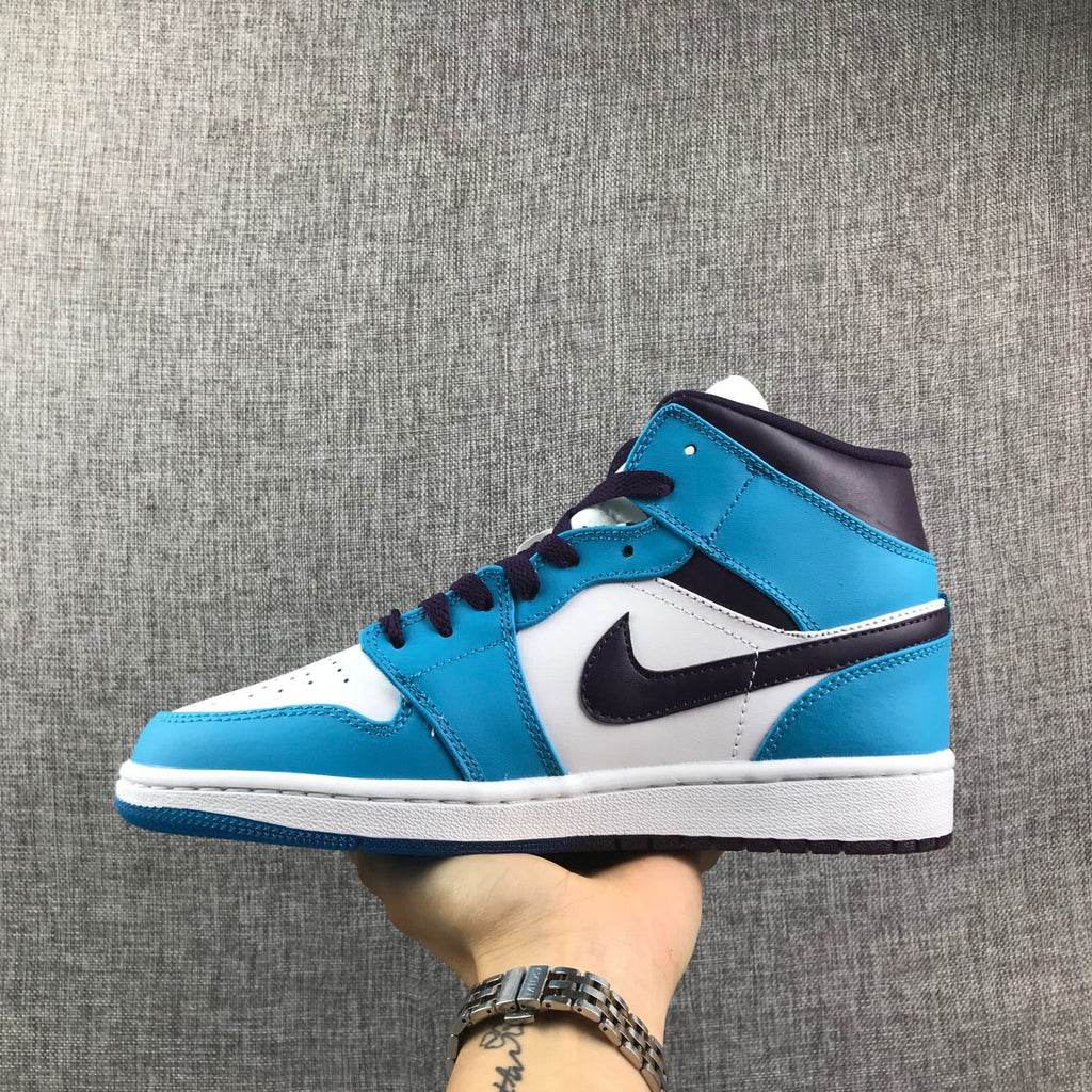 Air Jordan 1 Mid Sneakers in Blue, in White and Black - product image from the listing.