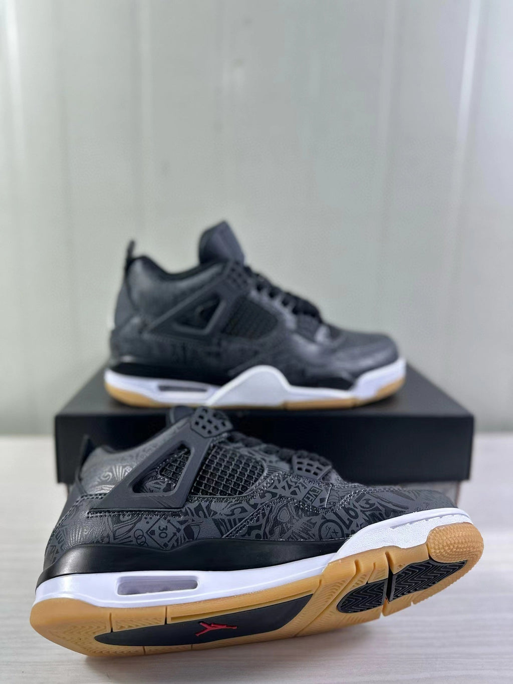 Air Jordan 4 Black Laser Sneakers CI2970-001 - product image from the listing.