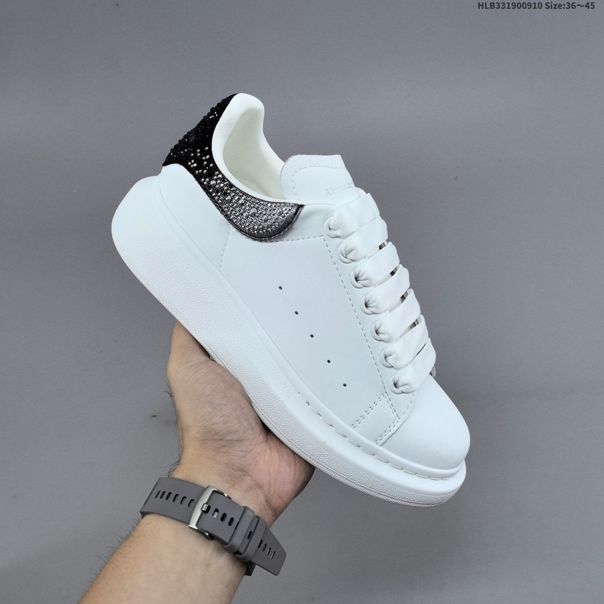 Alexander McQueen Oversized Low-Cut Sneakers with Crystal Heel - product image from the listing.