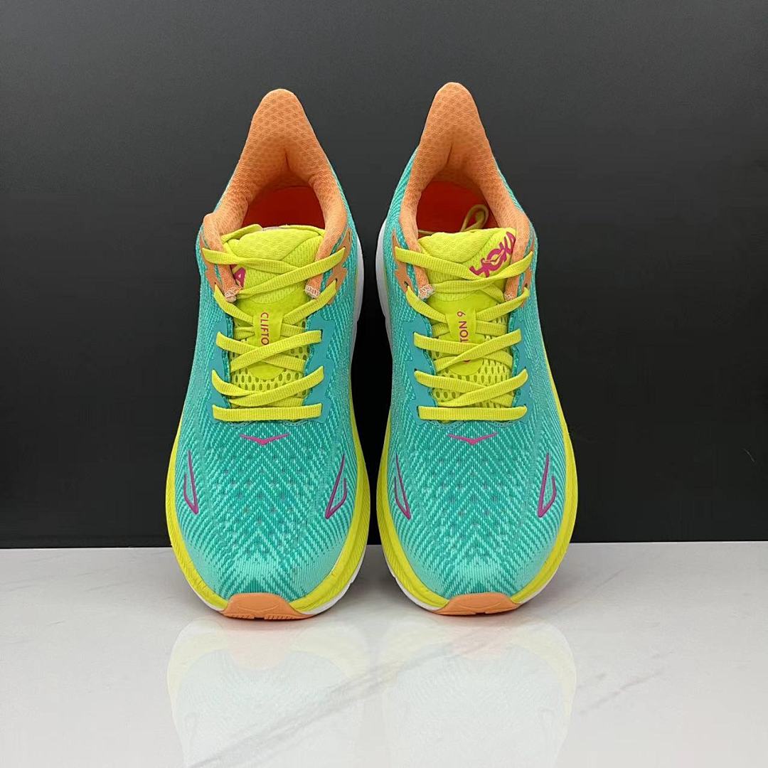 Teal and Orange HOKA Clifton 9 Running Shoes - product image from the listing.