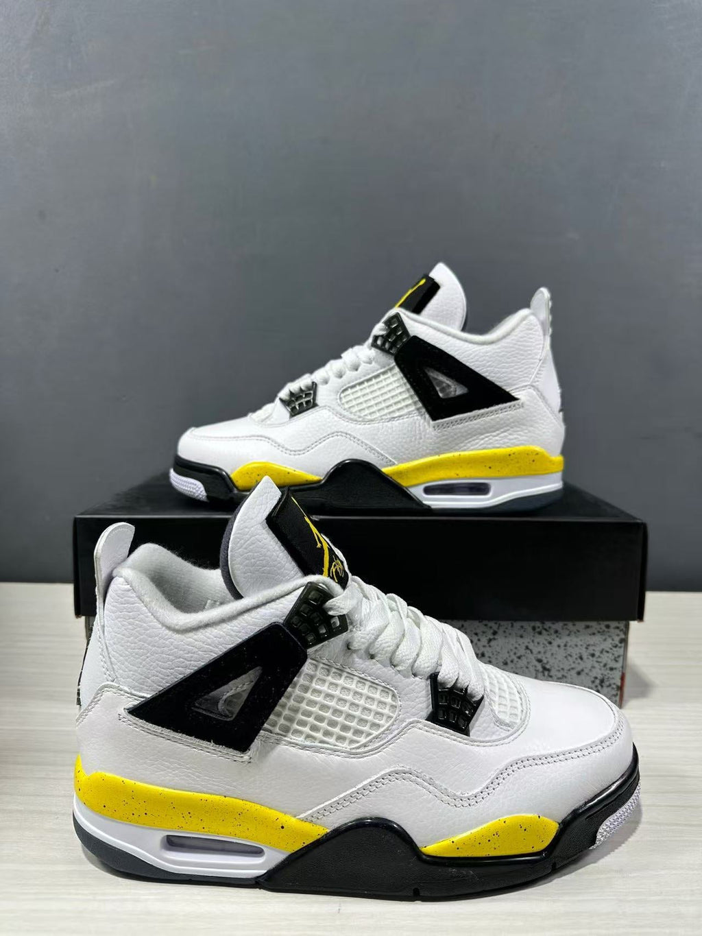 Air Jordan 4 Retro White Yellow Black Sneakers IO2468-102 - product image from the listing.