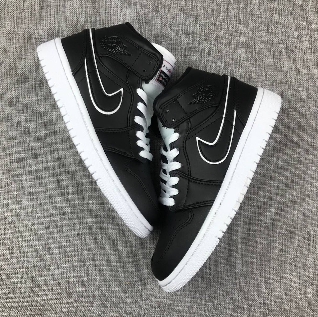 Air Jordan 1 Mid Sneakers in Black and White 852542-016 - product image from the listing.