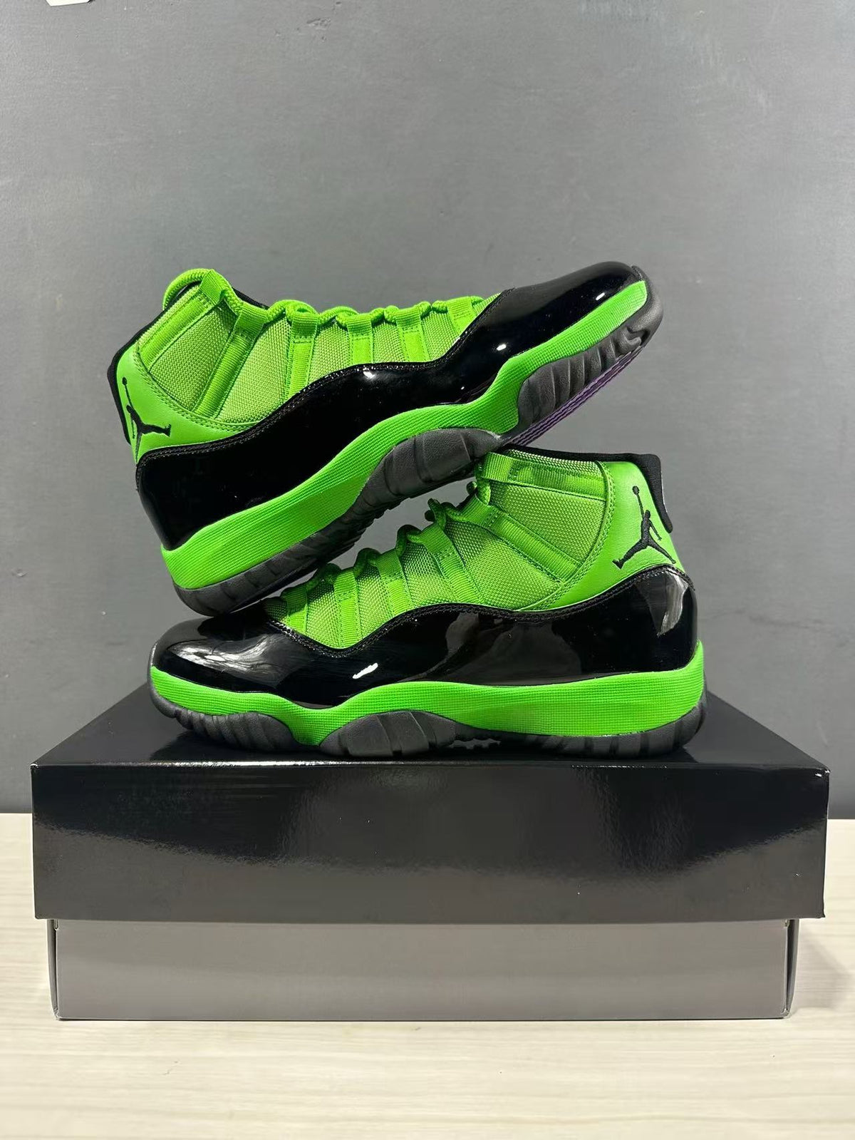 Air Jordan 11 Retro Sneakers in Black Green CT8012-310 - product image from the listing.