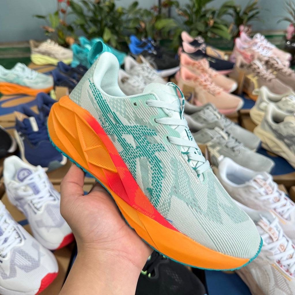 ASICS NOVABLAST 5 LE Running Shoes in White Orange - product image from the listing.