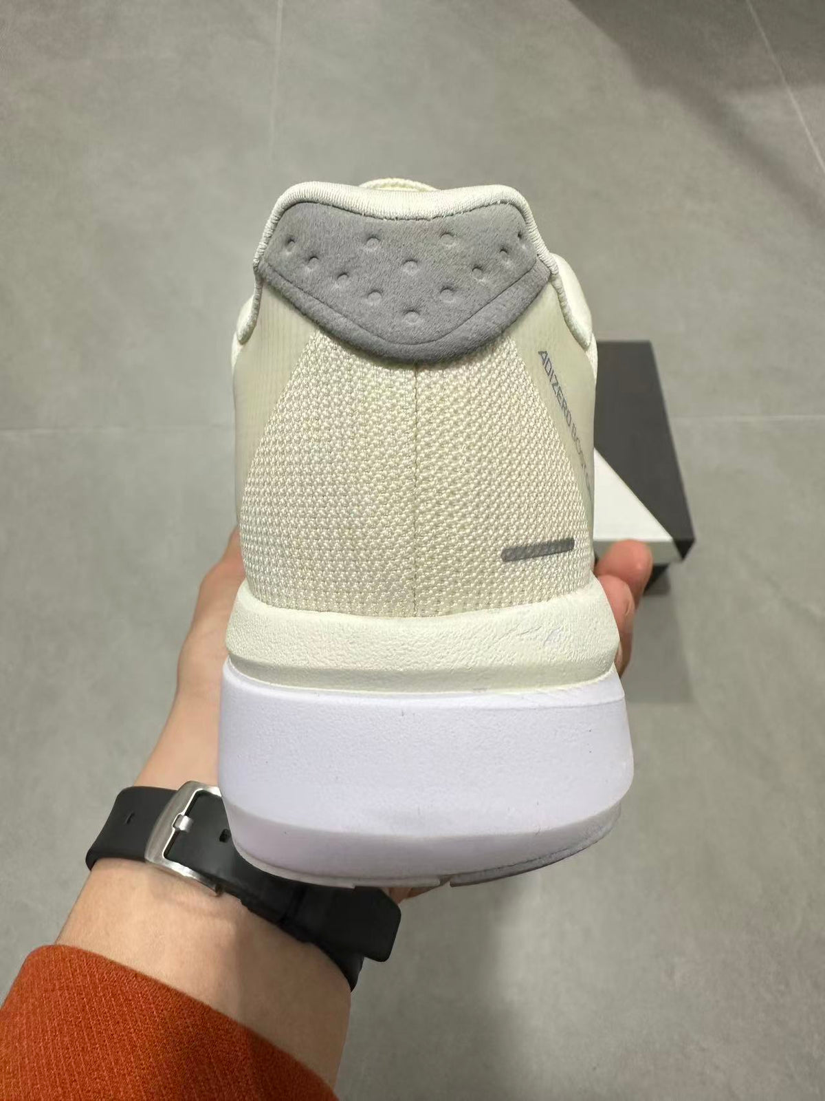 Adizero Lightstrike Pro Running Shoes in White and Olive JS4947 - product image from the listing.