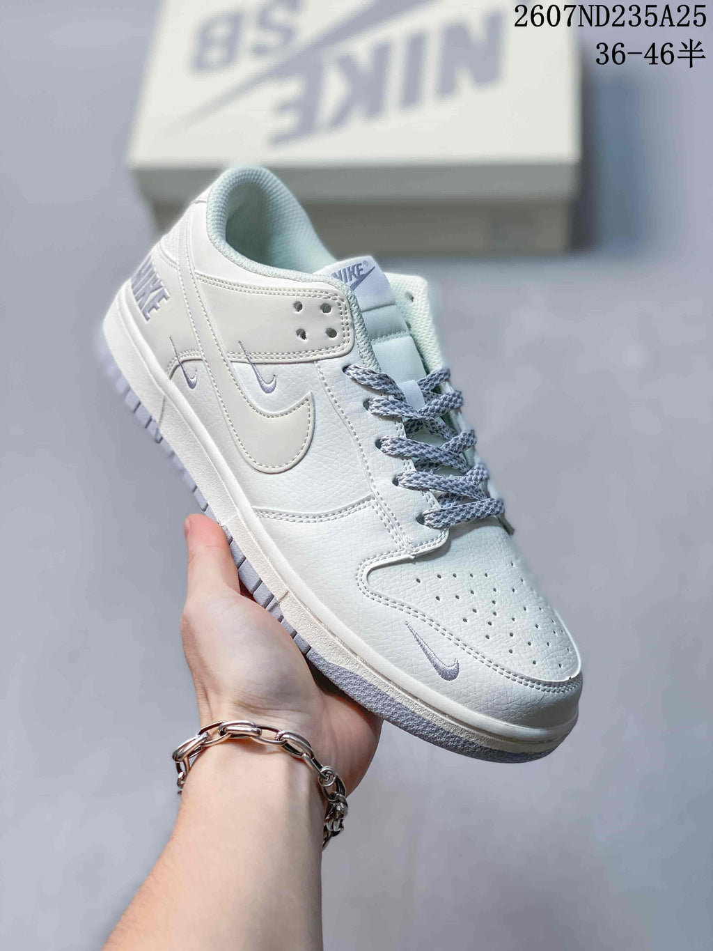 Nike SB Dunk Low Pro Sneakers in White Grey 2607ND235A25 - product image from the listing.