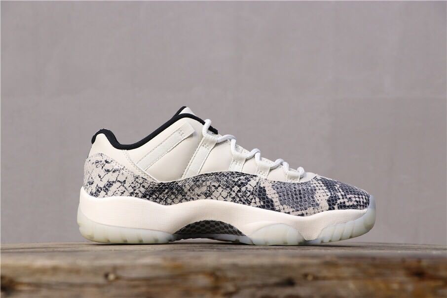 Air Jordan 11 Retro Low White Black Snakeskin Sneakers - product image from the listing.