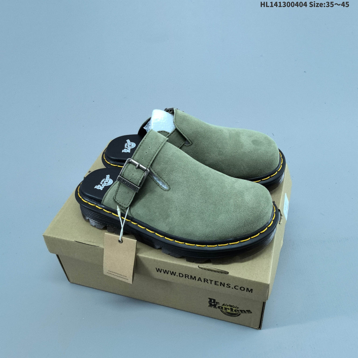 Buckle-Strap Mule Clogs in Black and Sage by Dr. Martens - product image from the listing.