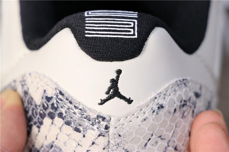 Air Jordan 11 Retro Low White Black Snakeskin Sneakers - product image from the listing.