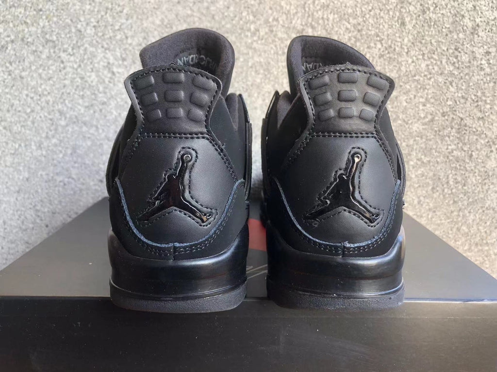 Jordan 4 Retro Black Cat Sneakers in Black - product image from the listing.