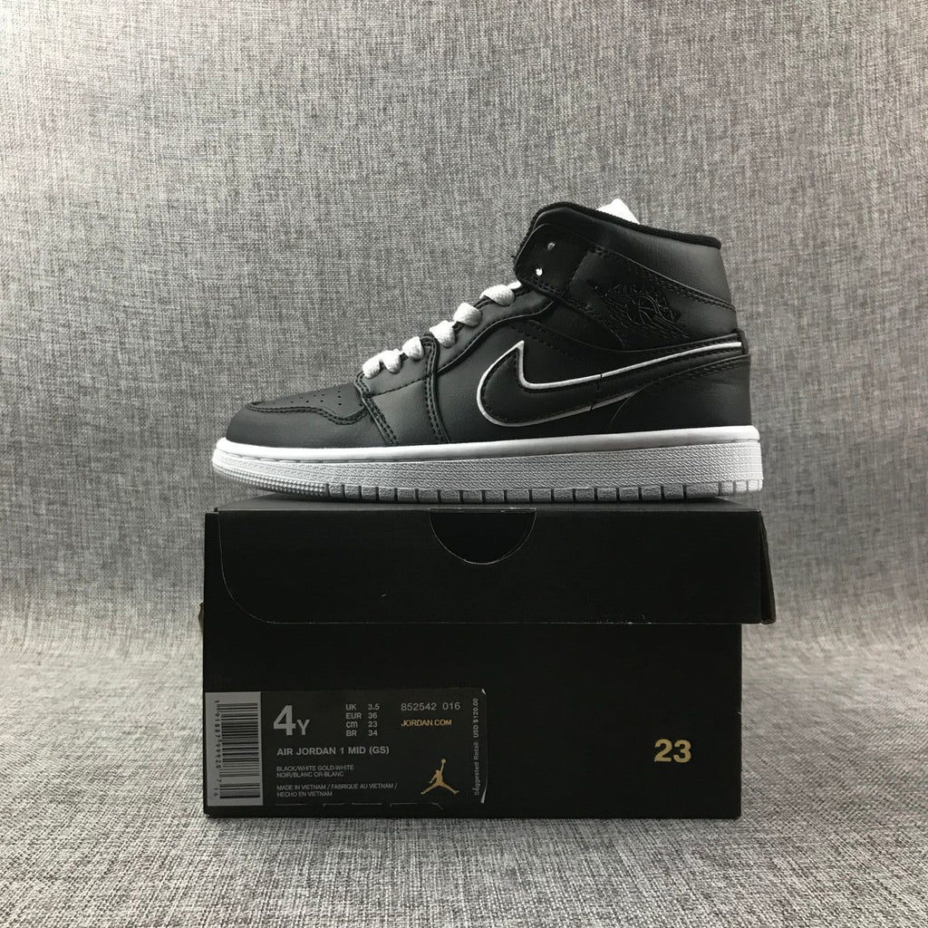 Air Jordan 1 Mid Sneakers in Black and White 852542-016 - product image from the listing.