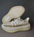 Light Gray and Cream Yeezy 350 V2 Knit Sneakers - product image from the listing.
