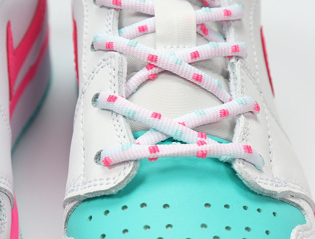 Jordan 1 Mid Sneakers in White Pink Turquoise 555112-102 - product image from the listing.