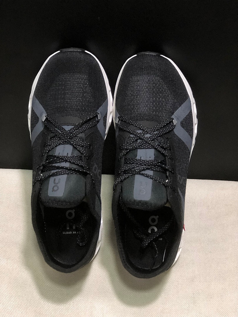 Black and White On Cloud X 4 AD Sneakers - product image from the listing.