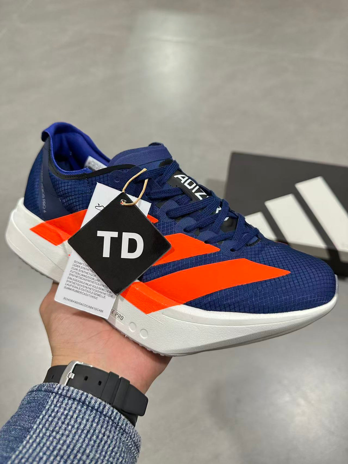 Nike Adizero Lightstrike Pro Running Shoes, in Navy and Orange - product image from the listing.