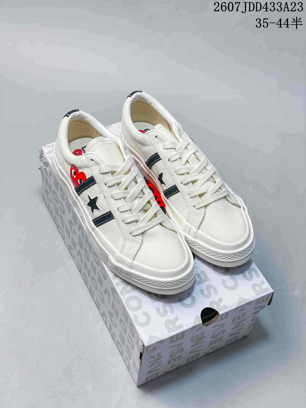 CDG Play x Converse One Star Academy Pro Sneakers in Navy White - product image from the listing.