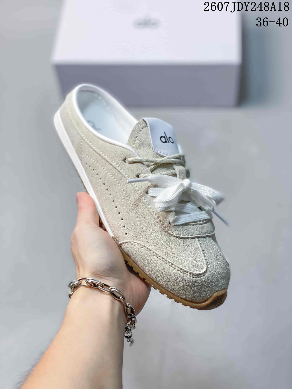 alo Sunset Mule Sneakers in Pink, in Navy and Cream - product image from the listing.