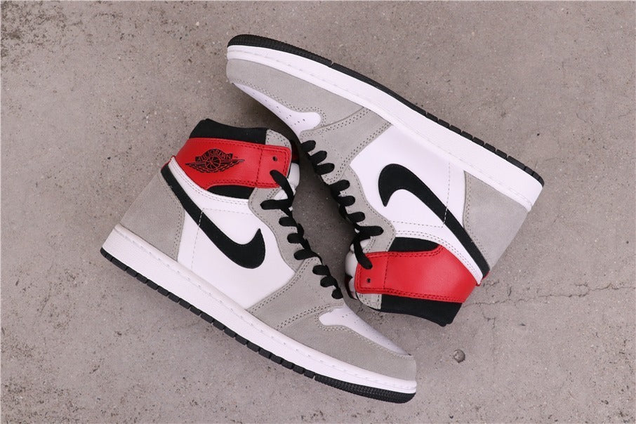 Air Jordan 1 High Sneakers in Light Smoke Grey 555088-126 - product image from the listing.
