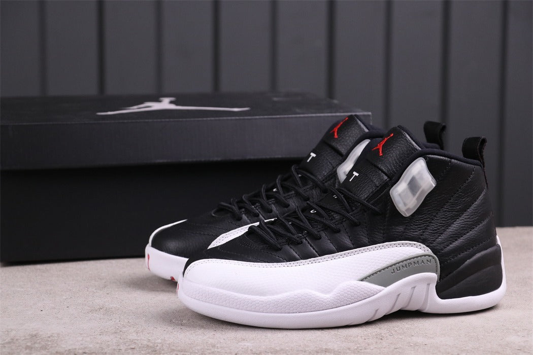 Air Jordan 12 Reverse Taxi Black White 130690-001 - product image from the listing.