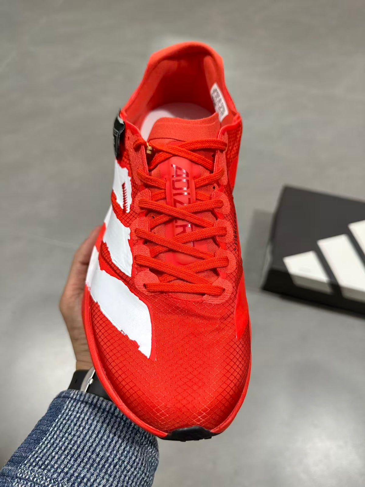 Adidas Adizero Adios Pro 4 Running Shoes in Red White JR6659 - product image from the listing.