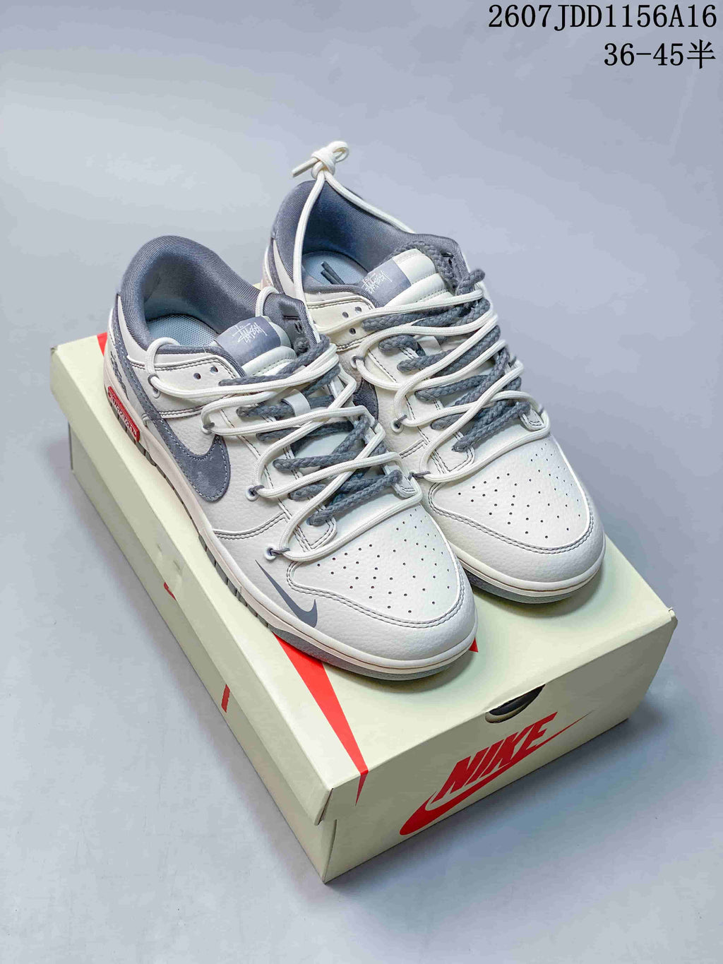 Nike SB Dunk Low Supreme-Style Sneakers in White Grey - product image from the listing.
