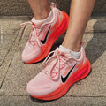 Nike Vomero 18 Running Shoes in Pink Black HM6804-600 - product image from the listing.