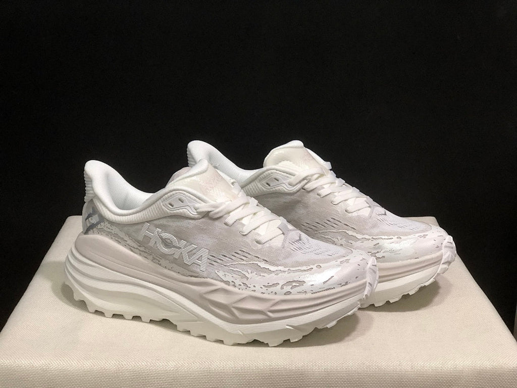HOKA Stinson 7 Sneakers in White and Gray - product image from the listing.