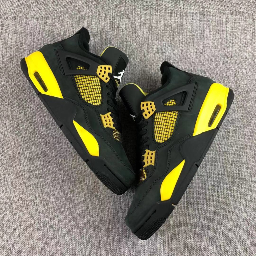 Air Jordan 4 Thunder Black Yellow Sneakers - product image from the listing.