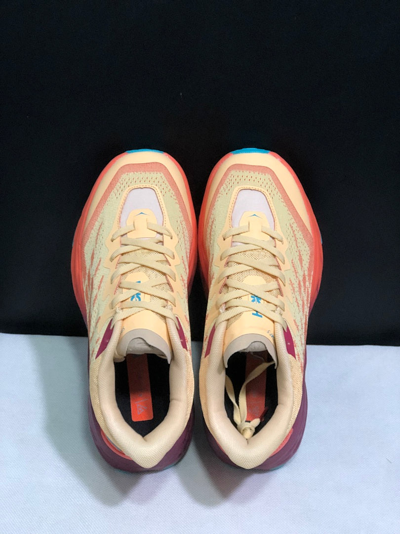 Yellow and Coral HOKA Speedgoat 5 Trail Running Shoes - product image from the listing.