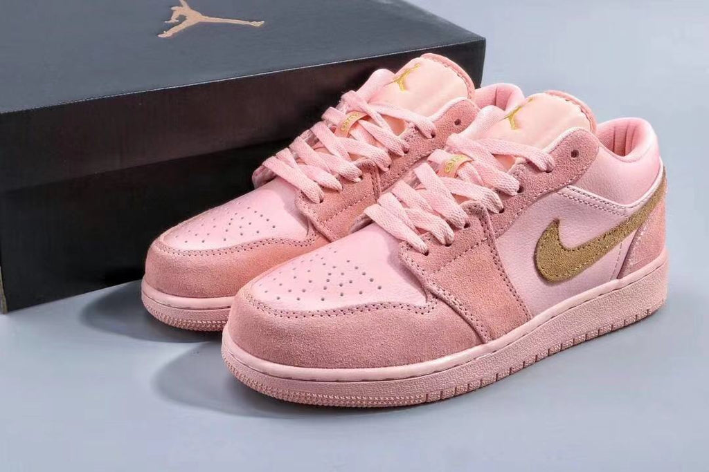 Women's Jordan 1 Low Pink and Gold Sneakers - product image from the listing.