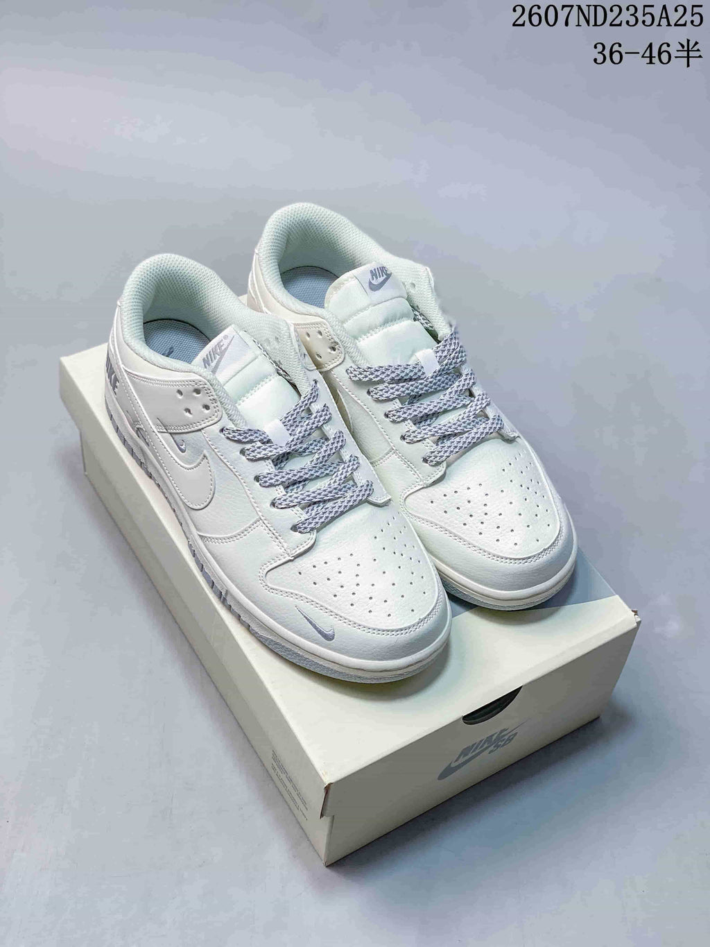 Nike SB Dunk Low Pro Sneakers in White Grey 2607ND235A25 - product image from the listing.