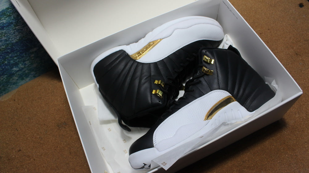 Air Jordan 12 Wings Black White Gold Sneakers 848692-033 - product image from the listing.