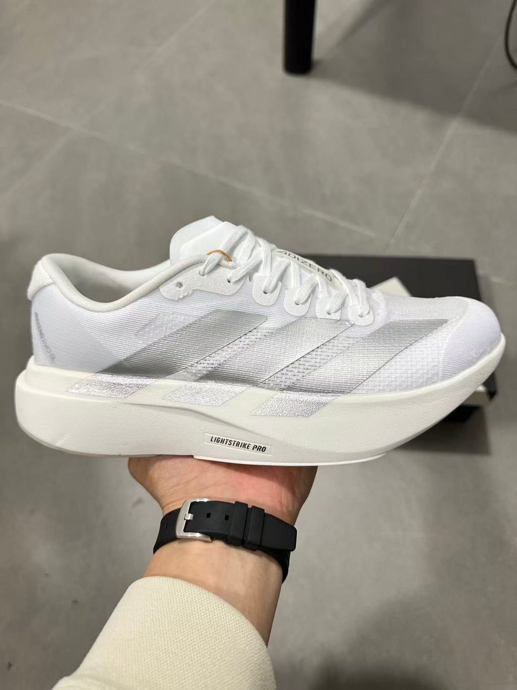 adidas Lightstrike Pro Running Shoes in White JR6207 - product image from the listing.
