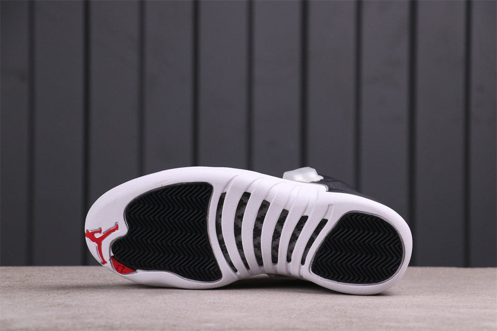 Air Jordan 12 Reverse Taxi Black White 130690-001 - product image from the listing.