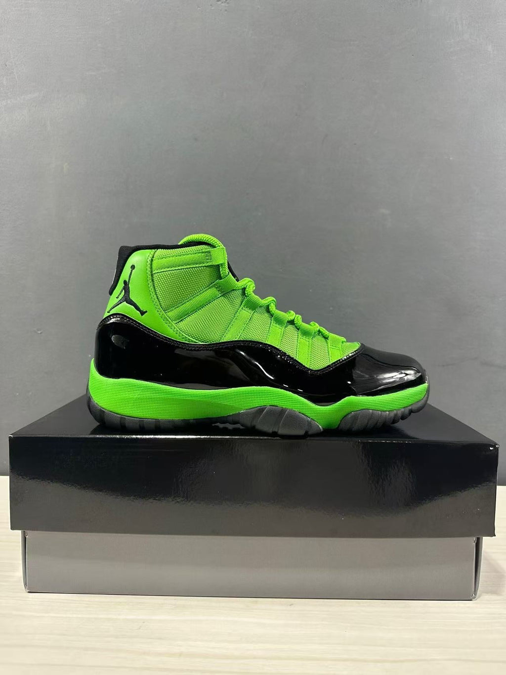 Air Jordan 11 Retro Sneakers in Black Green CT8012-310 - product image from the listing.