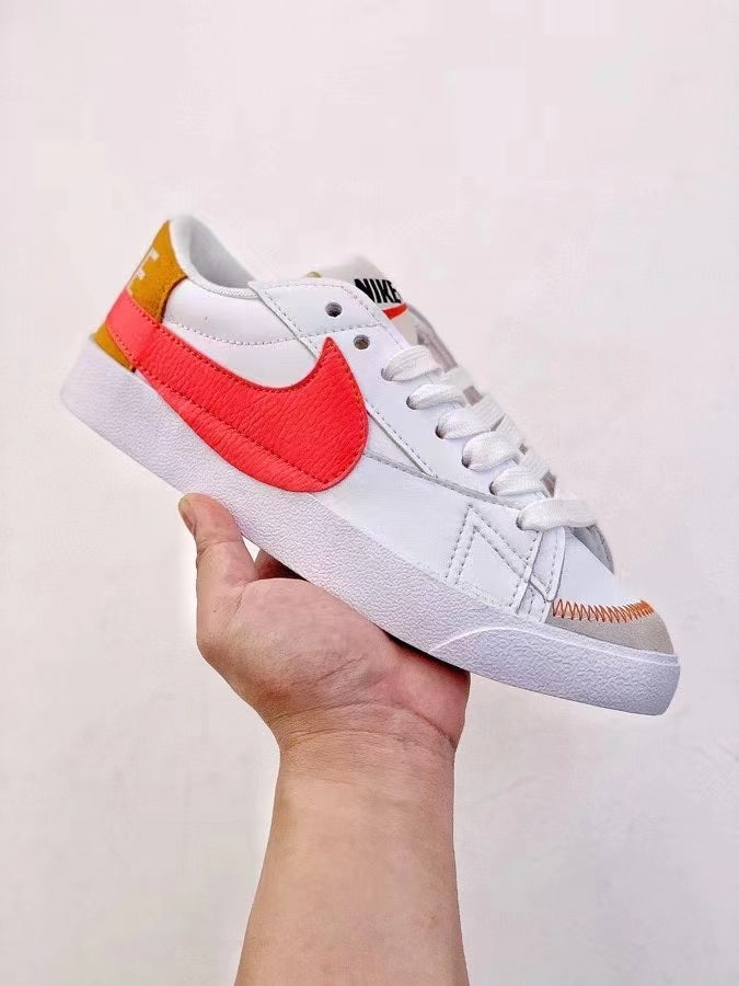 Nike Blazer Mid '77 Sneakers in White and Bright Coral - product image from the listing.