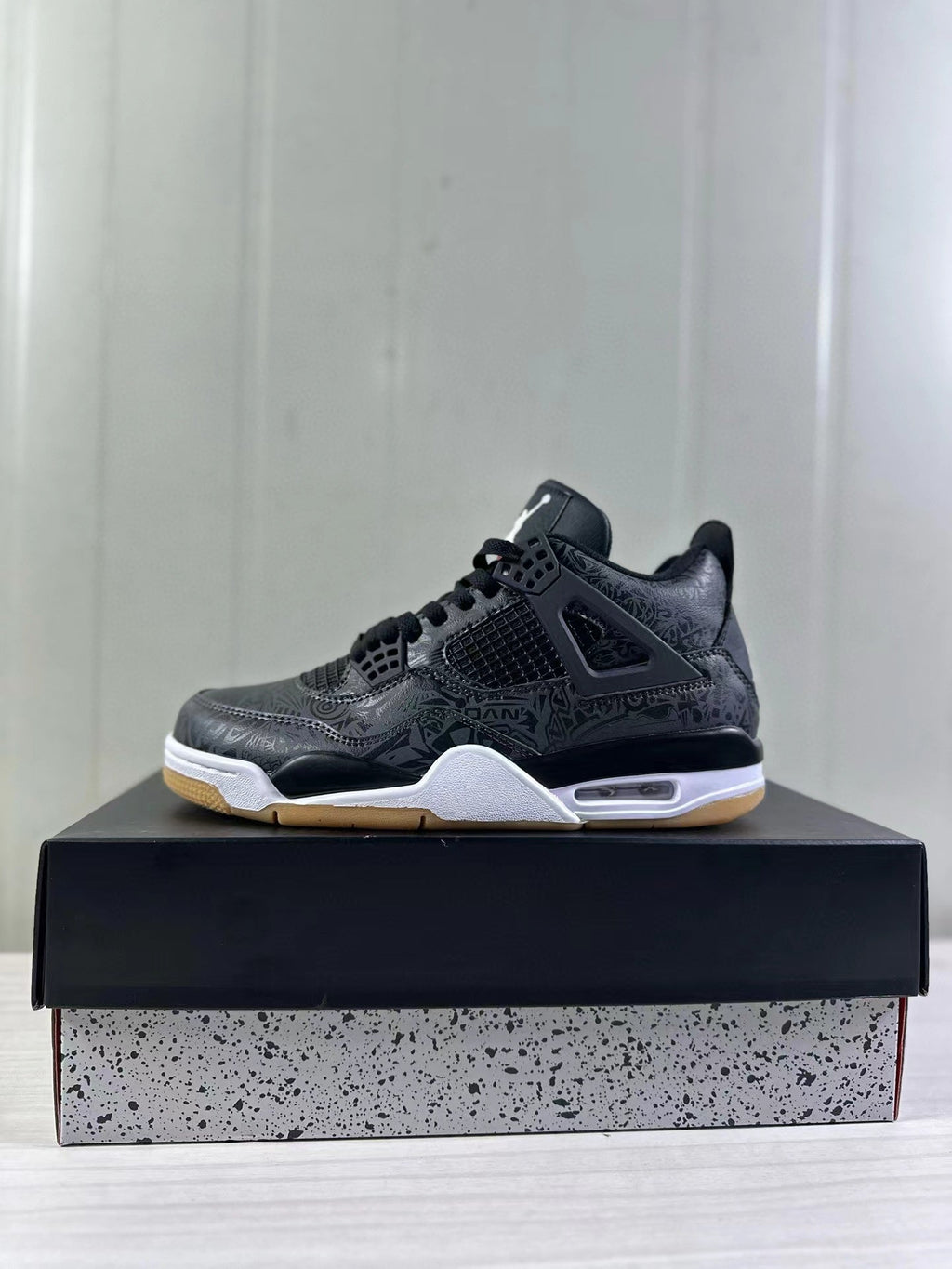 Air Jordan 4 Black Laser Sneakers CI2970-001 - product image from the listing.