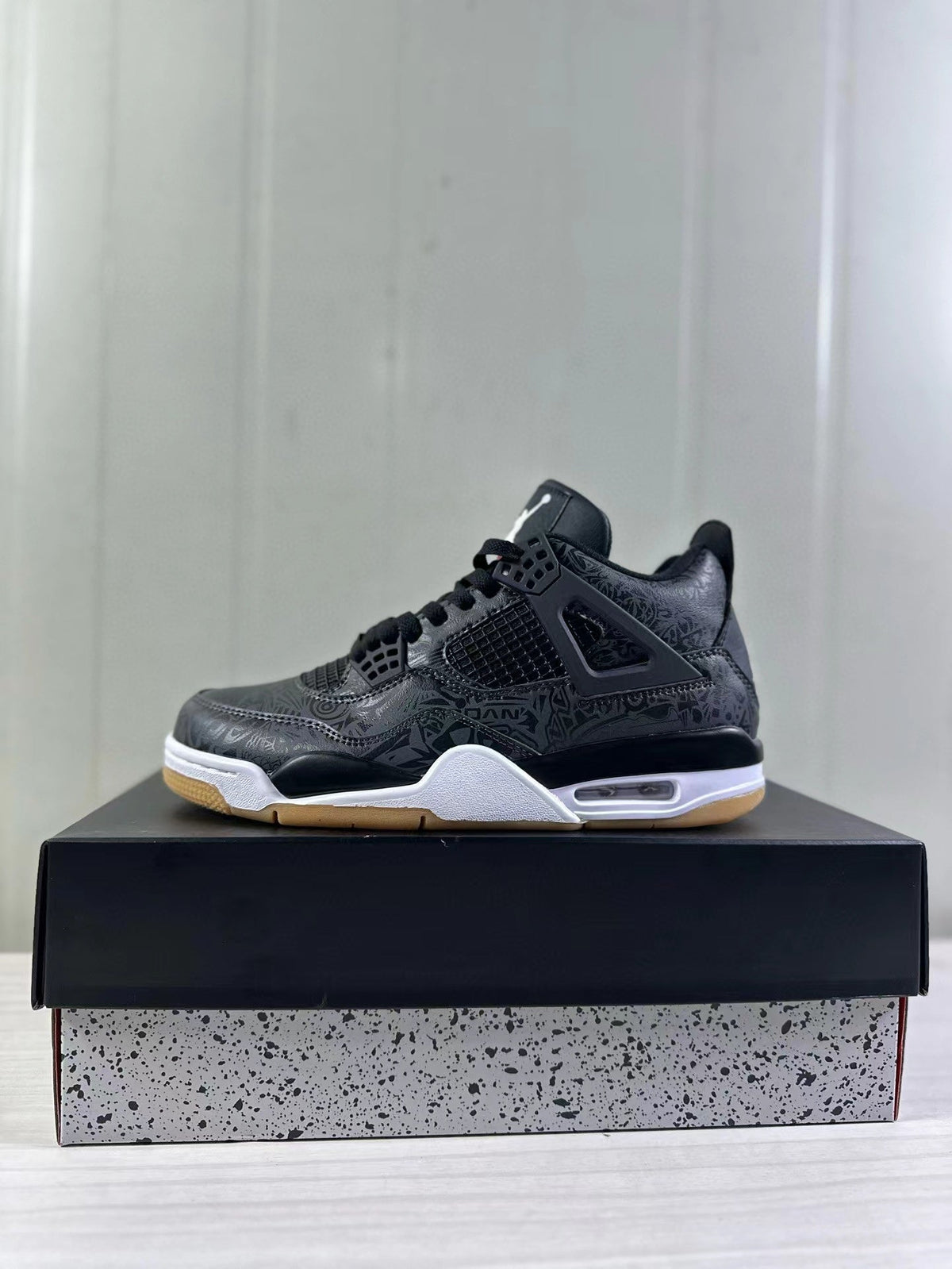 Air Jordan 4 Black Laser Sneakers CI2970-001 - product image from the listing.
