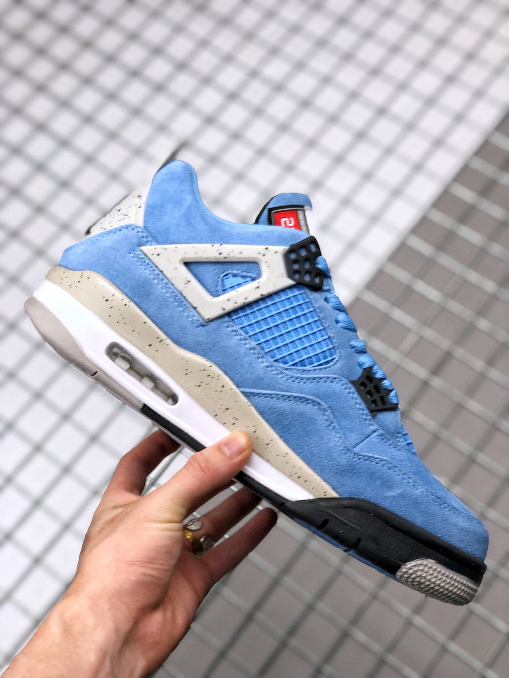 Air Jordan 4 University Blue Sneakers CT8527-400 - product image from the listing.