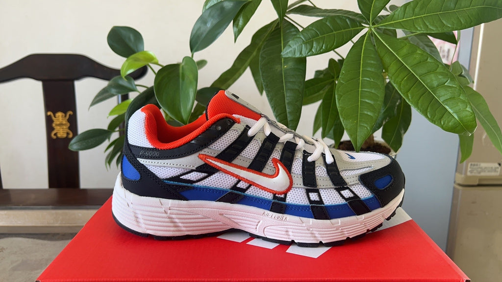 Nike P-6000 Sneakers in White Black Blue CD6404-008 - product image from the listing.