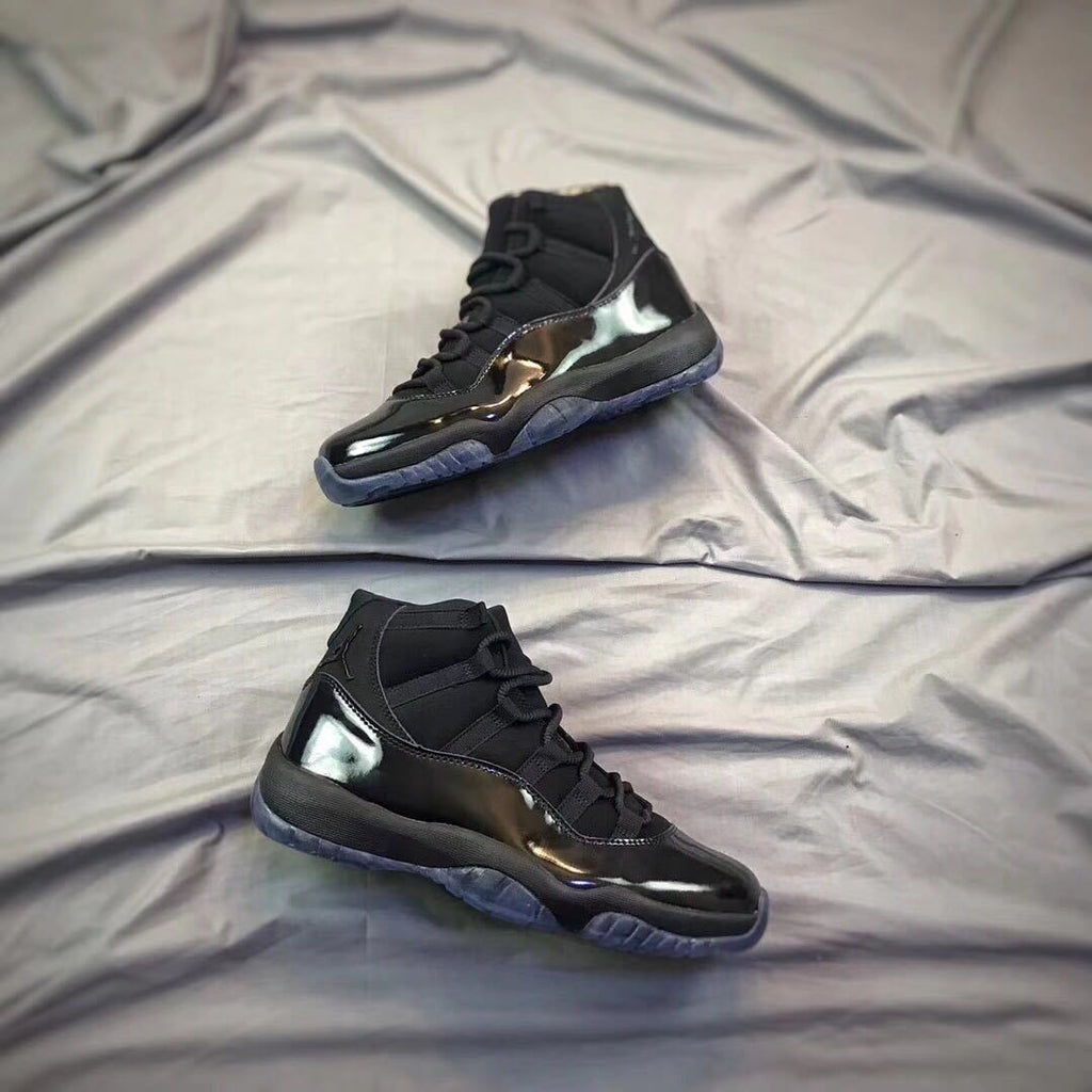 Air Jordan 11 Cap and Gown High-Top Sneakers in Black - product image from the listing.