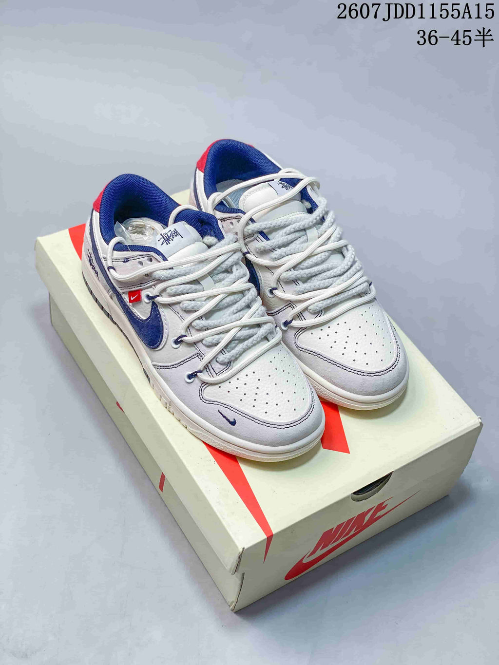 Nike SB Dunk Low Stussy Sneakers in White Grey Navy - product image from the listing.