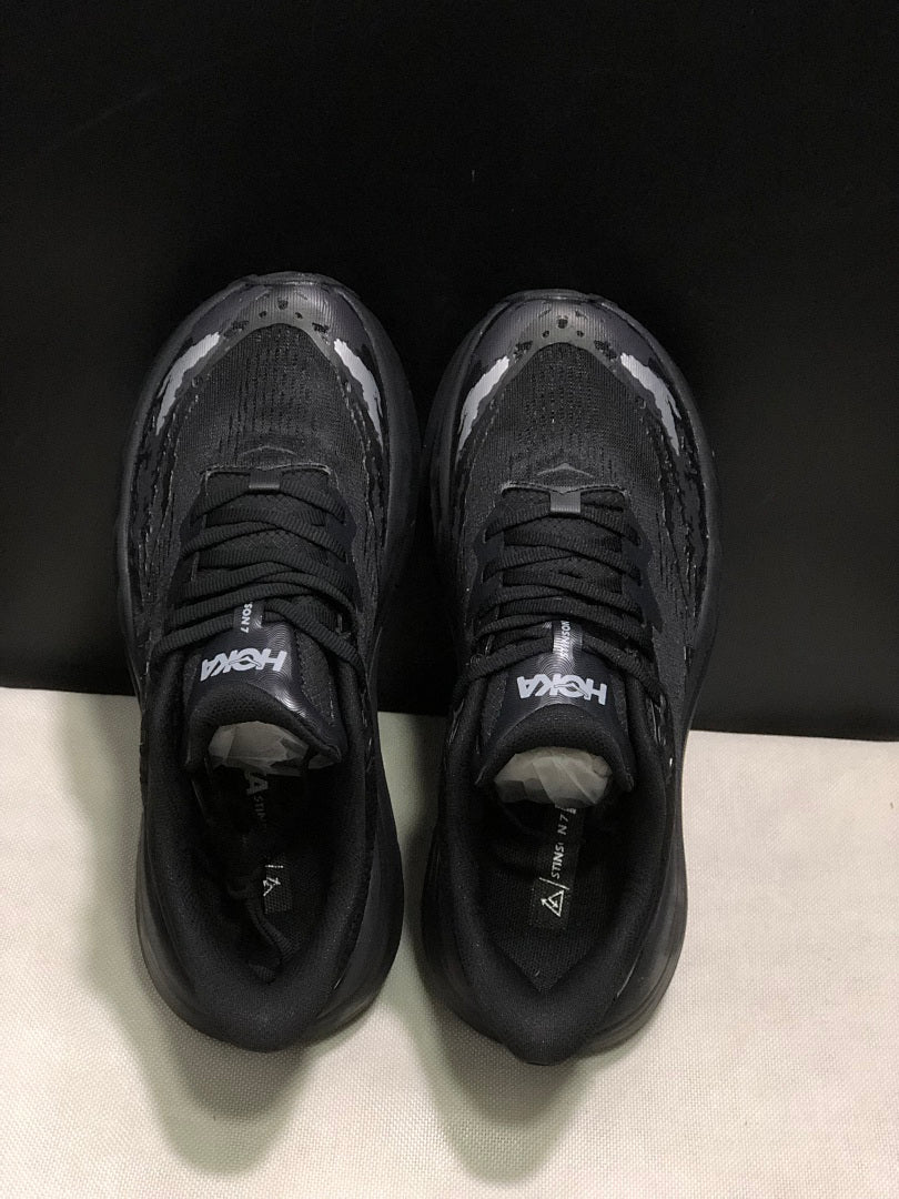 HOKA Stinson 7 Black Trail Trainers - product image from the listing.