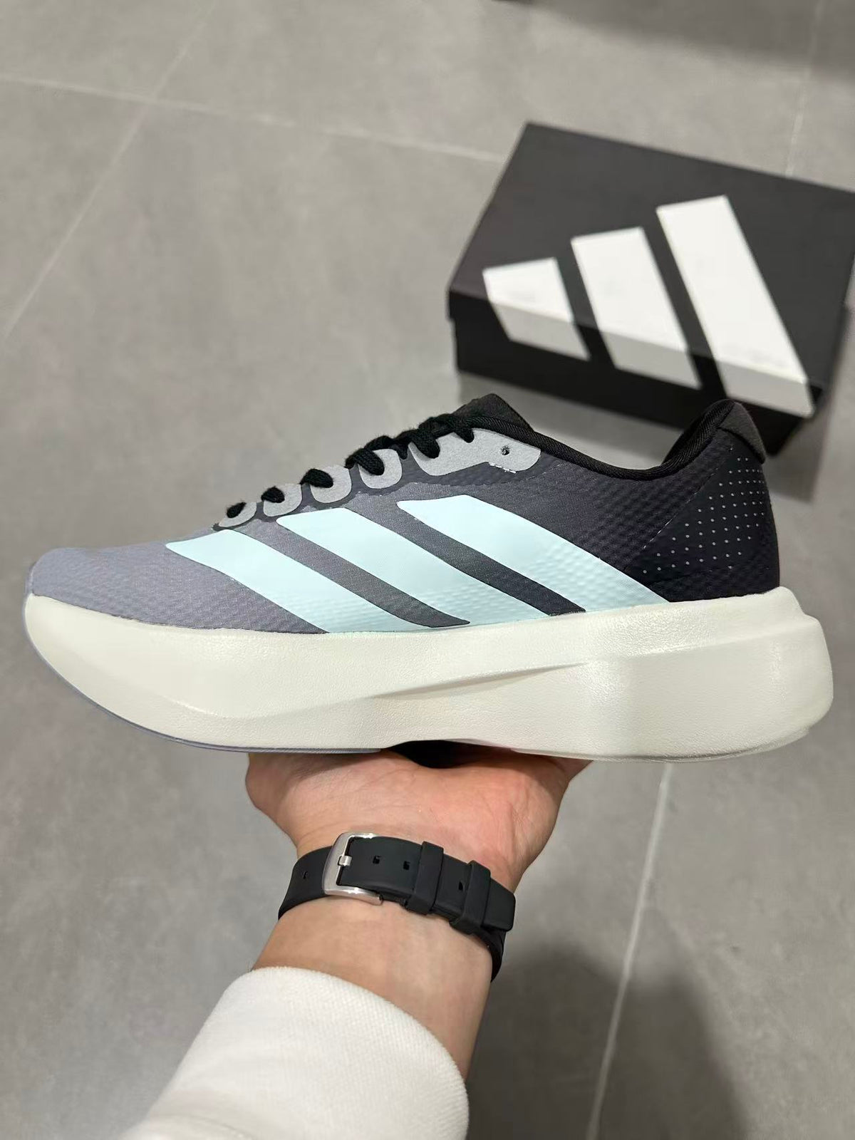 Gray and Blue Adidas Lightstrike Pro Running Shoes - product image from the listing.