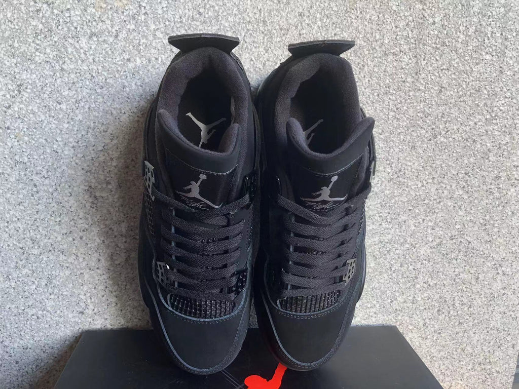 Jordan 4 Retro Black Cat Sneakers in Black - product image from the listing.