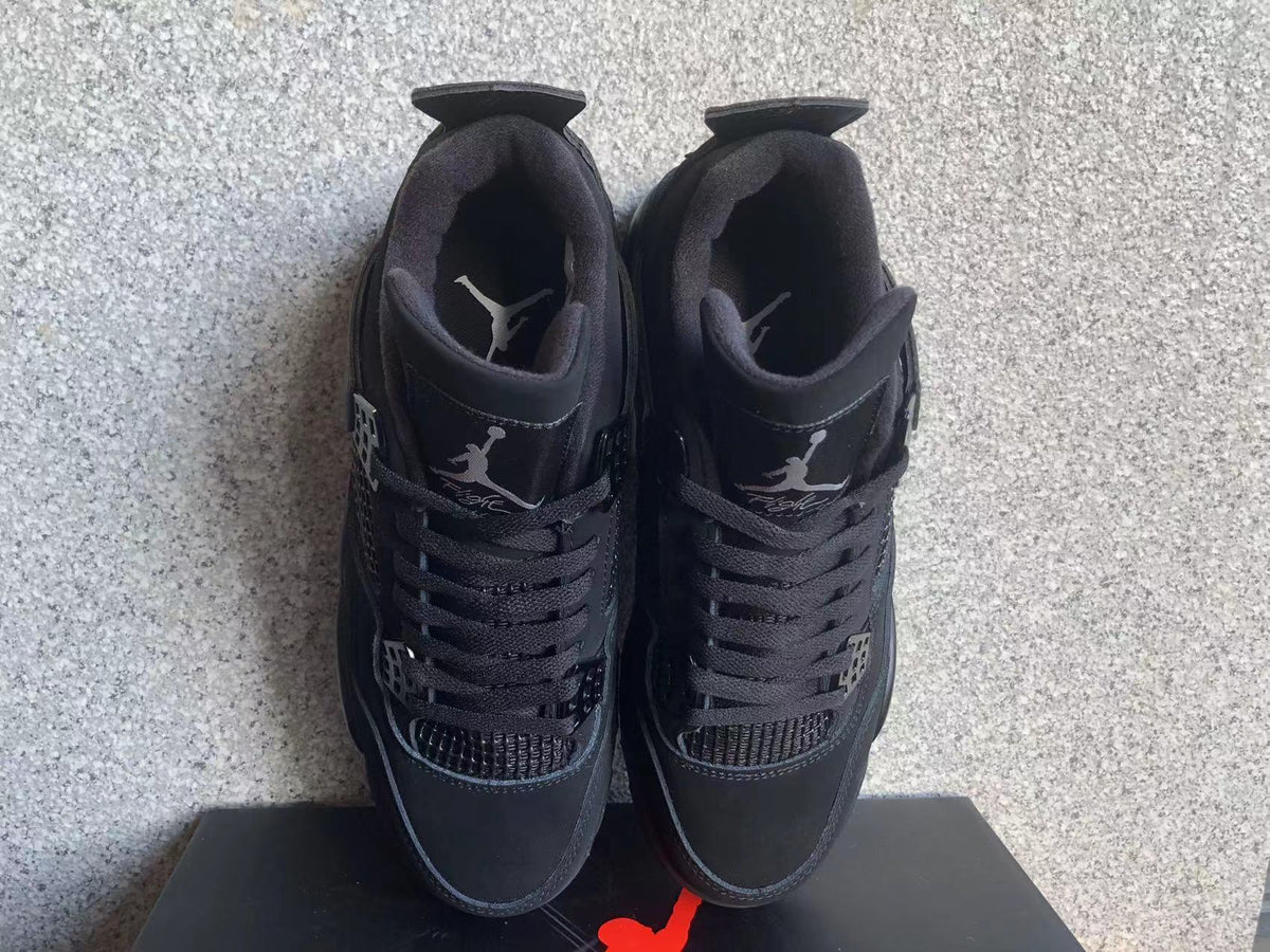 Jordan 4 Retro Black Cat Sneakers in Black - product image from the listing.