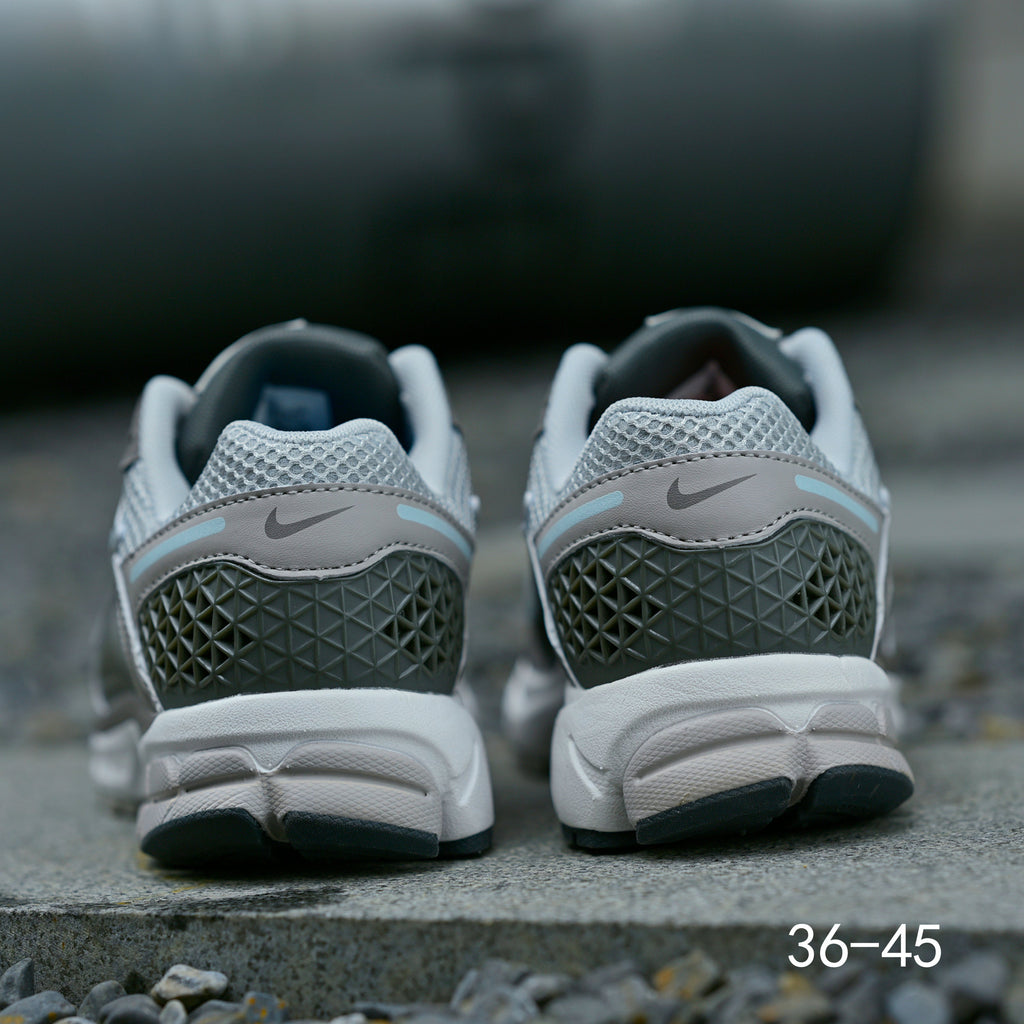 Grey Nike Air Zoom Vomero 5 Running Shoes - product image from the listing.