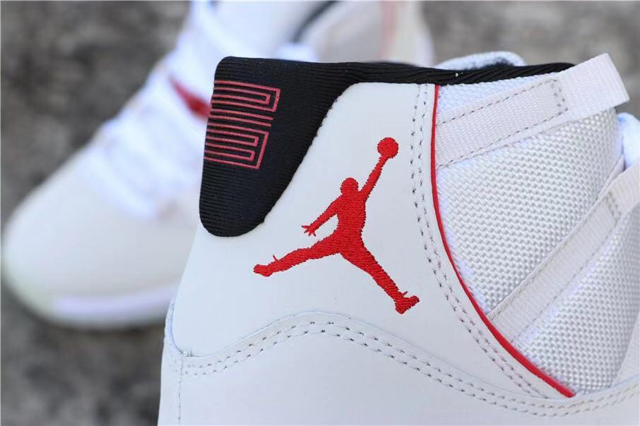 Air Jordan 11 Platinum Tint White High-Top Sneakers - product image from the listing.