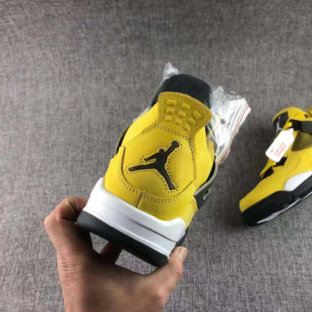 Air Jordan 4 Lightning Yellow Black Sneakers - product image from the listing.