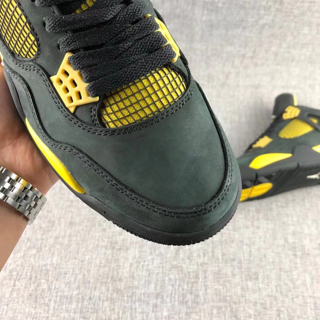 Air Jordan 4 Thunder Black Yellow Sneakers - product image from the listing.